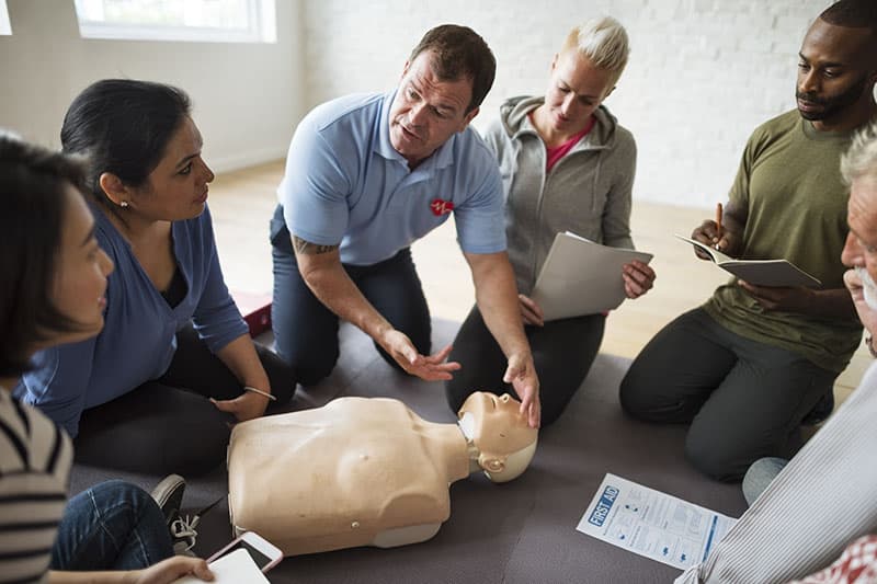 Trainer teaching CPR training