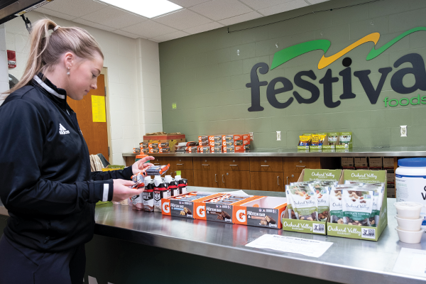 Sports student checking out the Festival foods fueling station