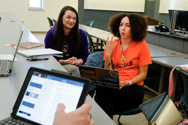 Students in class work in small groups