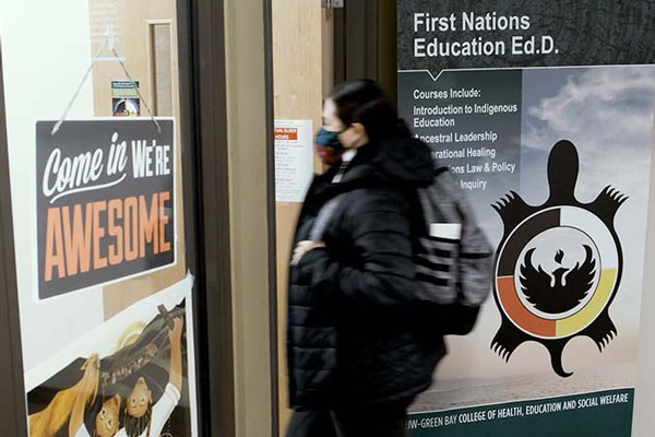 Student entering the First Nations Education Ed.D. office