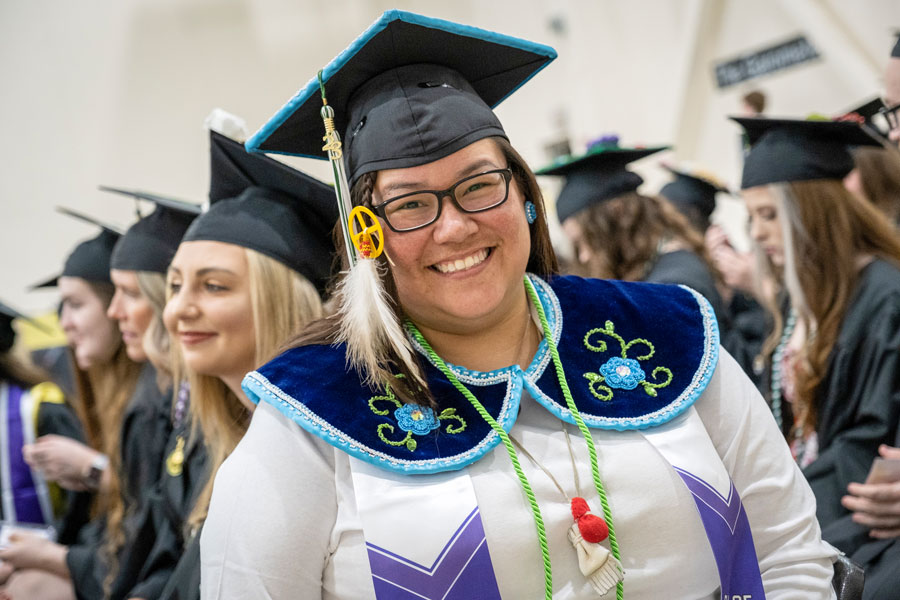 Student in tradition tribal wear at commencement 