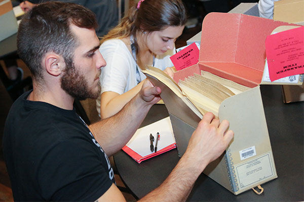 UWGB students using a vertical file for research