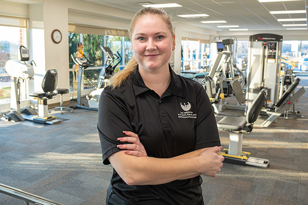 Fitness instructor in weight room