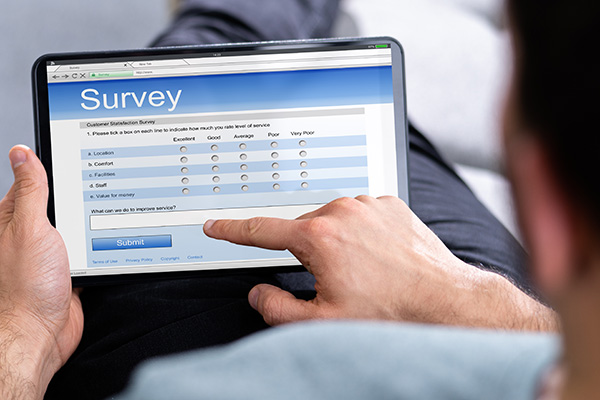 Man taking survey on ipad