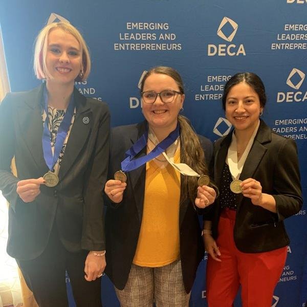 Three DECA award winners