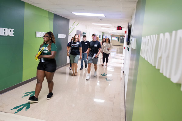 Tour guide leads students through campus