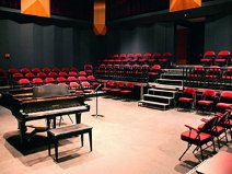 Grand piano with seating