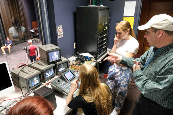 UW-Green Bay Lecturer Mike Schmitt advises Communication students in the production control room