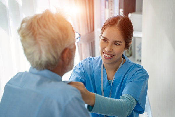 Nurse works with elderly patient