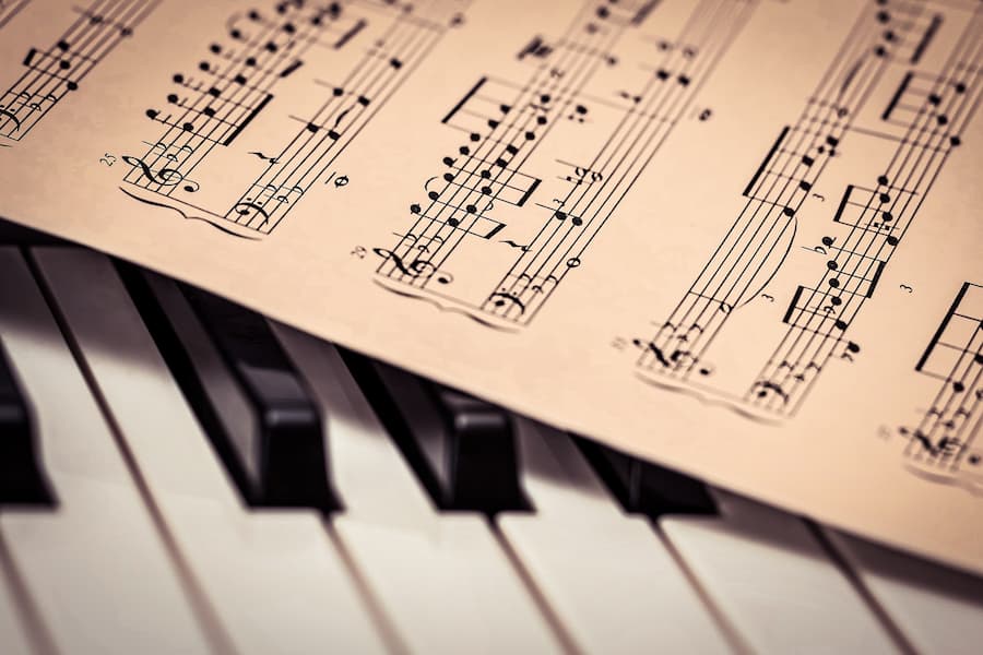 sheet music on piano keys
