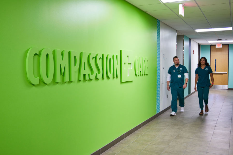 Two students walking down hallway