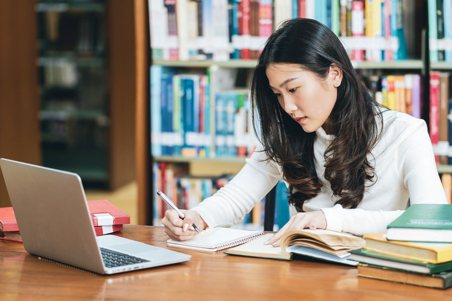 Student studying at laptop