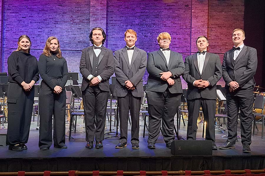 Student musicians at front of stage