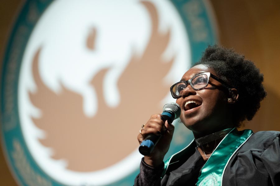 Aisa Rogers singing at a UW-Green Bay commencement ceremony