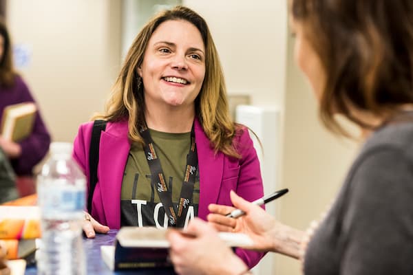 Professor Rebecca Meacham talks with student