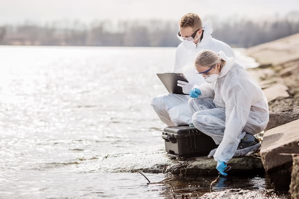 wo environmentalists perform water tests