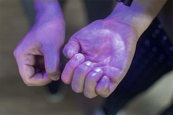 Hand washing activity with a black light