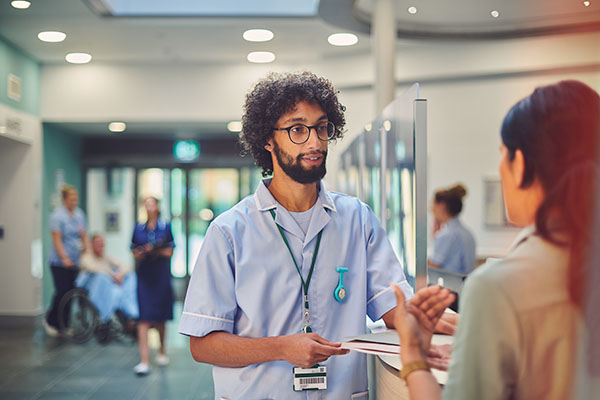 male nurse talking to supervisor