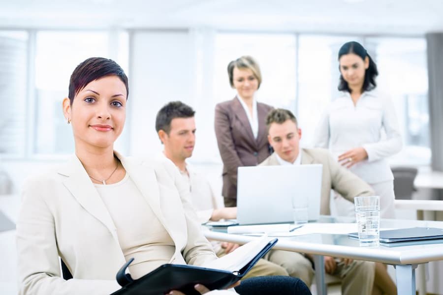 business team in a meeting with confident woman