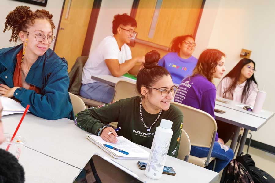 Group of diverse students attend class