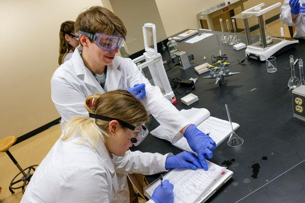 Two students working in lab