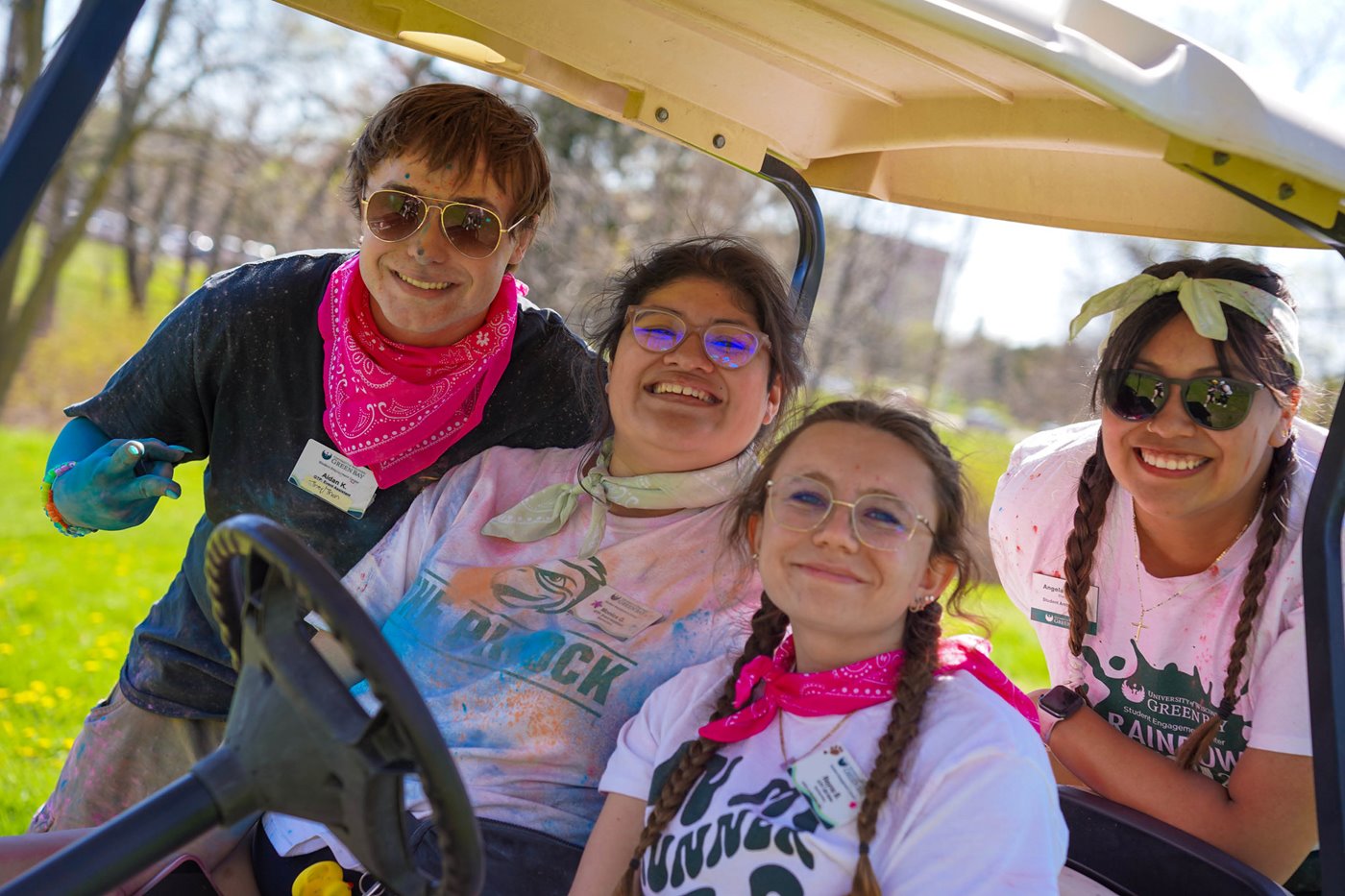 Four student employees work the Rainbow Rush event