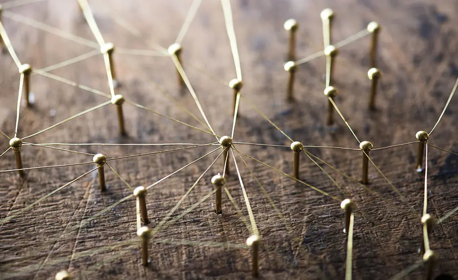 pins on a pegboard connected by string