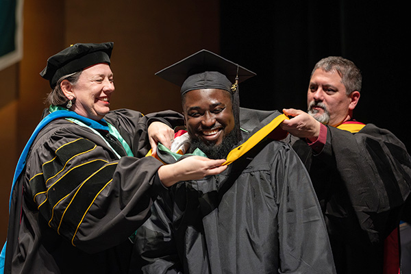 Graduate at commencement