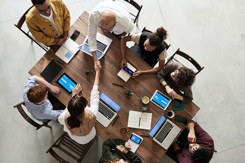 Birds eye view of team working on goals at a table