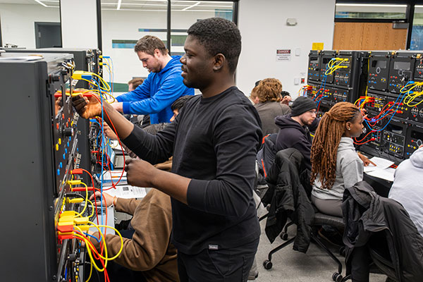 Electrical Engineering students perform experiments during Energy Conversion Lab inside the Electricial Machines Lab at UW-Green Bay