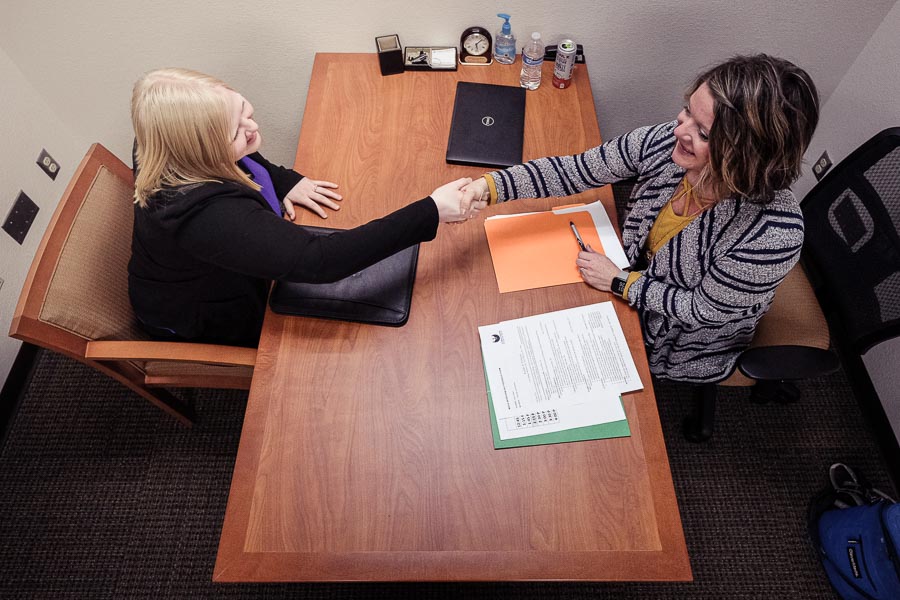 Candidate and hiring manager meet at an interview