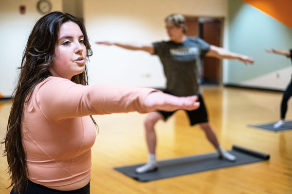 Female leads Yoga class at UW-Green Bay Kress Center