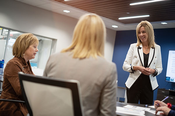 women in classroom learning from instructor