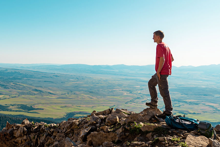 Young man standing on mountain