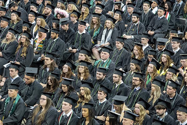 Students sitting in rows during 2023 graduation.