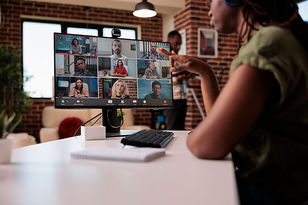 woman participating in virtual meeting