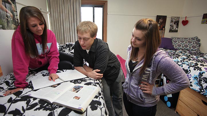UW-Green Bay students studying in a dorm room