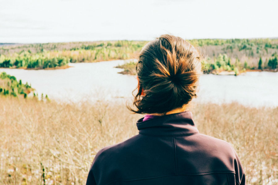 Female looks ahead into the wetlands