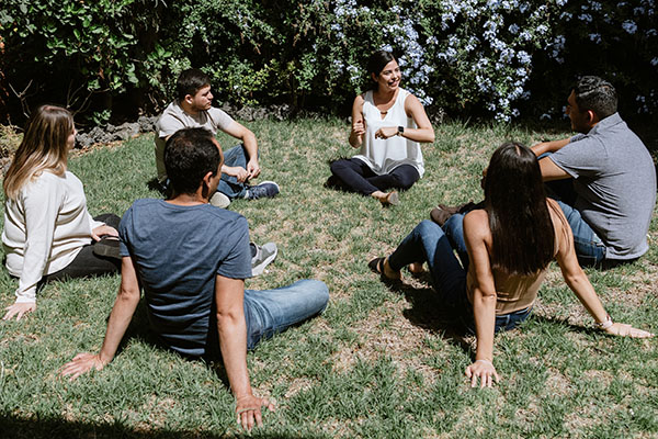 Circle of people talking outdoors