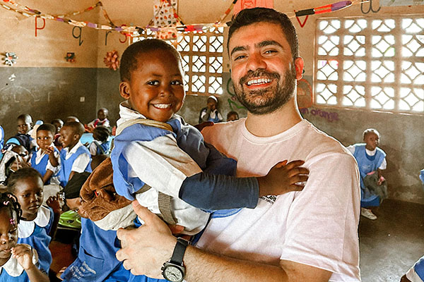 Caucasian teacher with African student