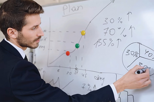 Josh writing on a whiteboard.