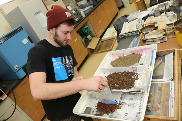 Student seperates out different sediment types
