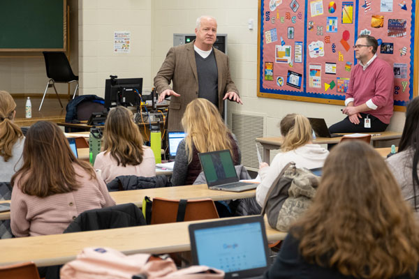 Teacher lecturing in classroom