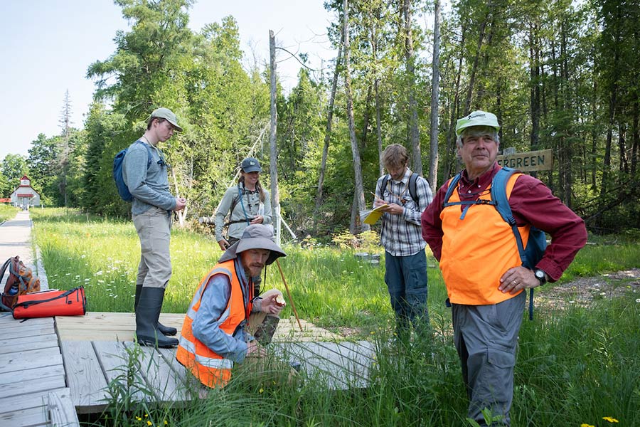 Students and professors complete research outside.