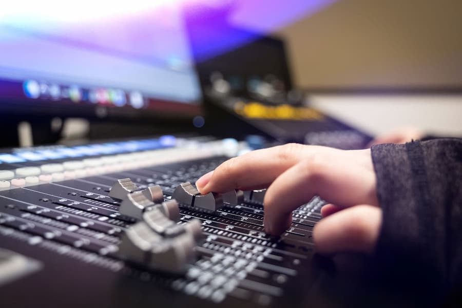 Person adjusting sound board