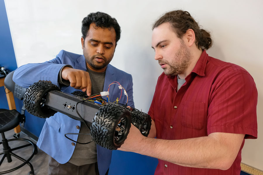 Student and professor work on smart robotic car