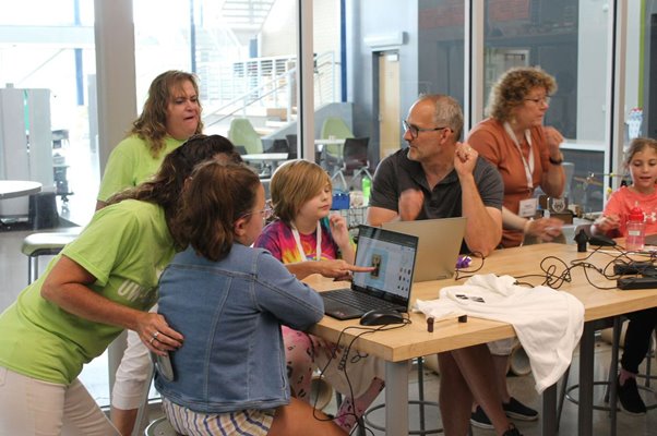 Design Tech campers using laptops for activities