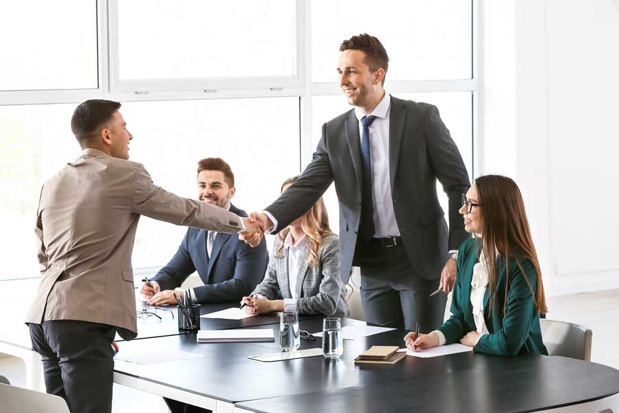 Two businessmen shake hands