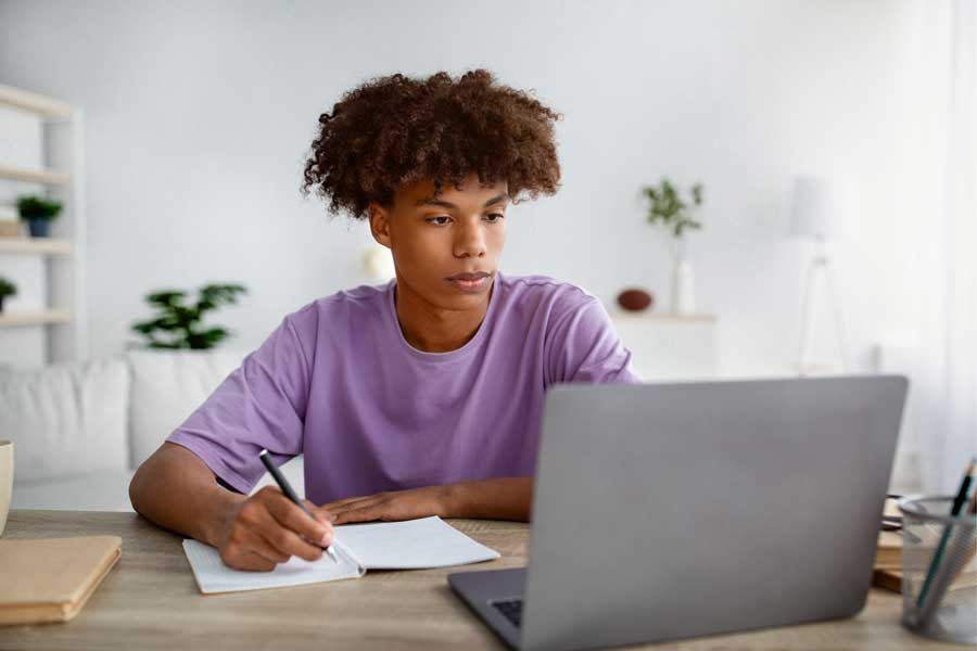 African American student searches online resources