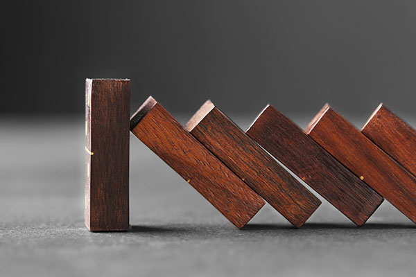 wooden dominoes on grey table